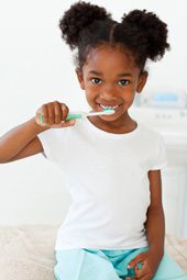 Young Girl Brushing Her Teeth